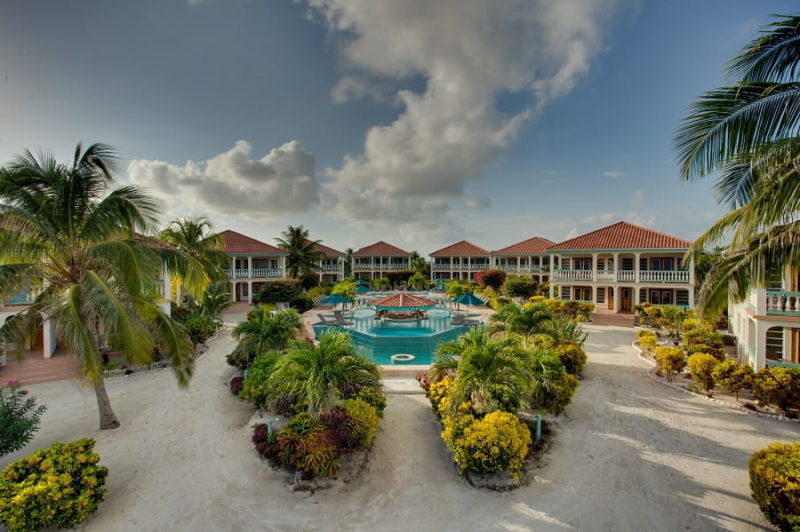 accommodations surrounding the main pool with pool swim up bar at belizean shores resort on the island of ambergris caye